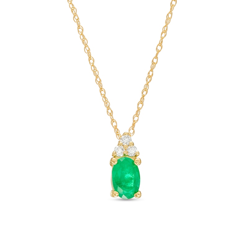 Oval Emerald and 1/20 CT. T.W. Diamond Tri-Sides Pendant in 10K Gold ...