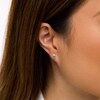 Thumbnail Image 2 of Oval Emerald and 1/20 CT. T.W. Diamond Stud Earrings in 10K Gold