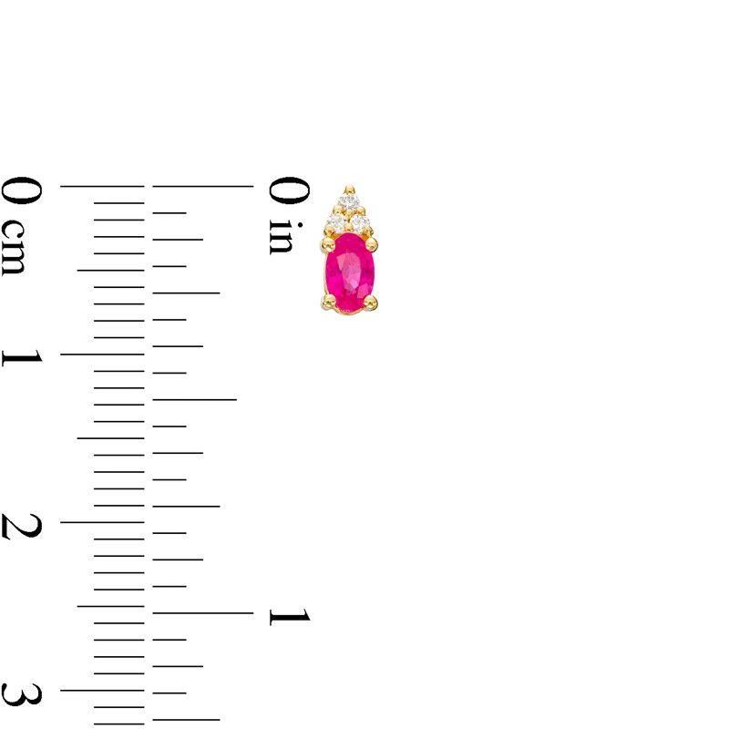 Main Image 3 of Oval Ruby and 1/20 CT. T.W. Diamond Stud Earrings in 10K Gold