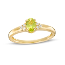 Oval Peridot and 1/20 CT. T.W. Diamond Tri-Sides Ring in 10K Gold - Size 7