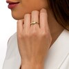 Thumbnail Image 2 of Oval Peridot and 1/20 CT. T.W. Diamond Tri-Sides Ring in 10K Gold - Size 7