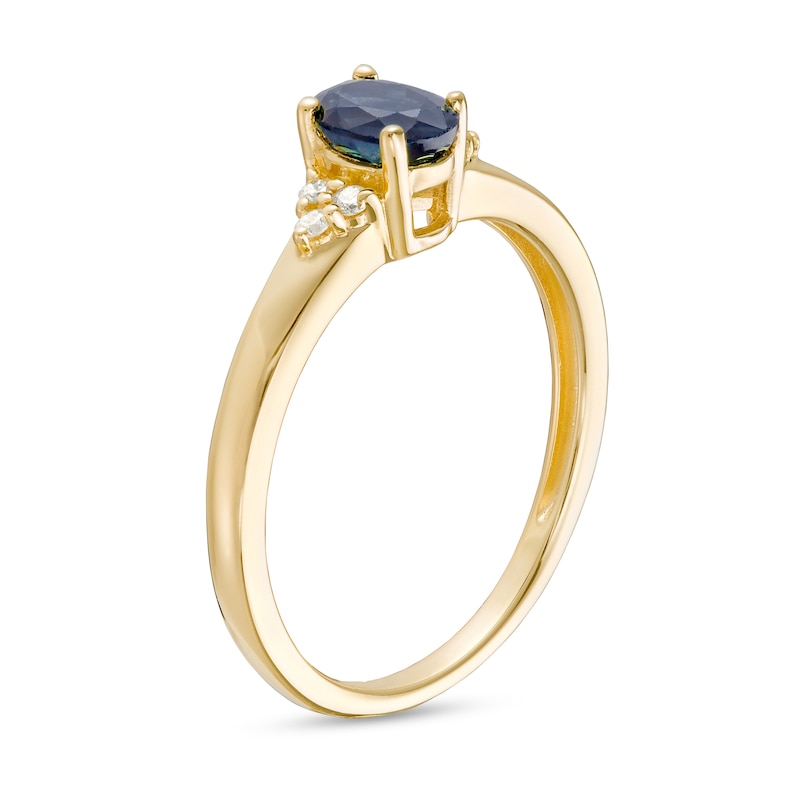 Main Image 3 of Oval Blue Sapphire and 1/20 CT. T.W. Diamond Tri-Sides Ring in 10K Gold - Size 7