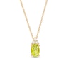 Thumbnail Image 1 of Oval Peridot and 1/20 Diamond CT. T.W. Diamond Pendant in 10K Gold