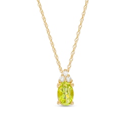 Oval Peridot and 1/20 Diamond CT. T.W. Diamond Pendant in 10K Gold
