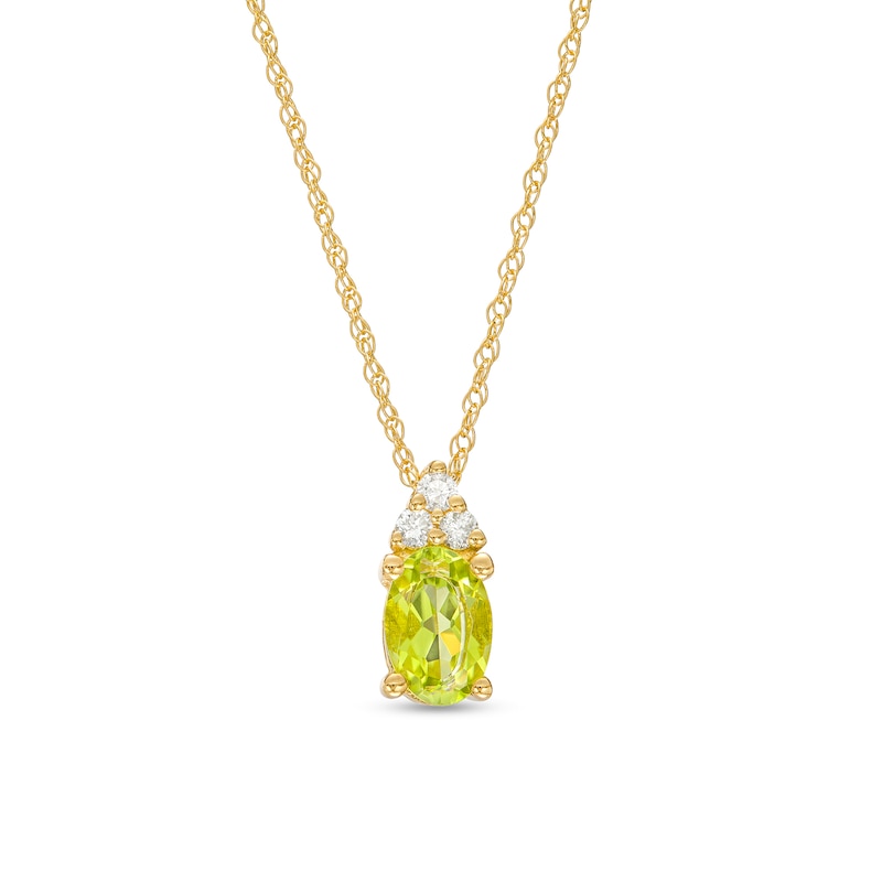 Main Image 1 of Oval Peridot and 1/20 Diamond CT. T.W. Diamond Pendant in 10K Gold