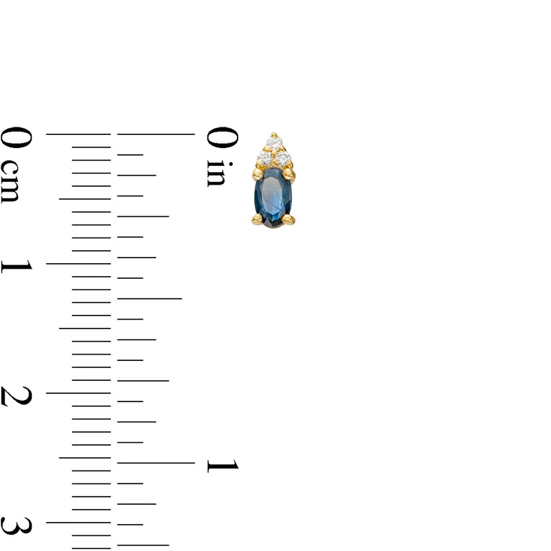 Main Image 3 of Oval Blue Sapphire and 1/20 CT. T.W. Diamond Stud Earrings in 10K Gold