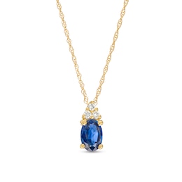 Oval Blue Sapphire and 1/20 CT. T.W. Diamond Pendant in 10K Gold