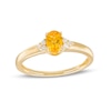 Thumbnail Image 0 of Oval Citrine and 1/20 CT. T.W. Diamond Tri-Sides Ring in 10K Gold - Size 7