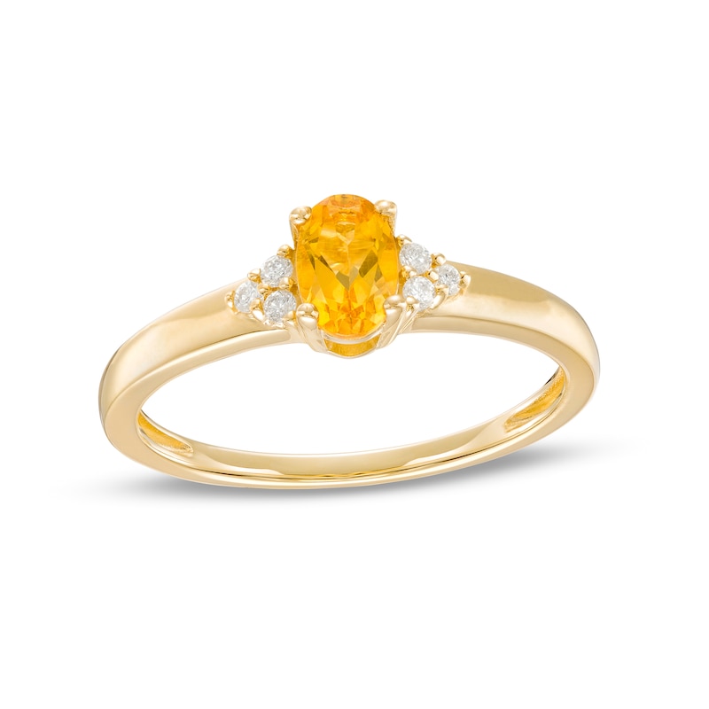 Oval Citrine and 1/20 CT. T.W. Diamond Tri-Sides Ring in 10K Gold - Size 7