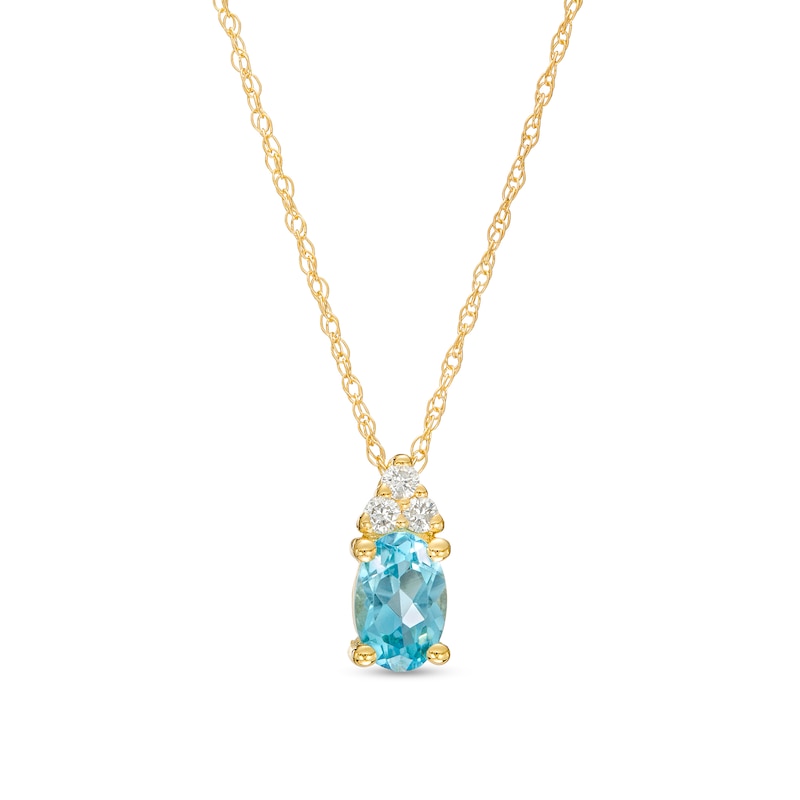 Oval Swiss Blue Topaz and 1/20 CT. T.W. Diamond Pendant in 10K Gold