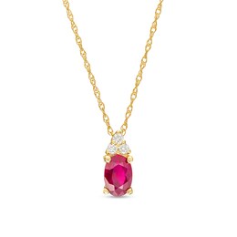 Oval Ruby and 1/20 CT. T.W. Diamond Pendant in 10K Gold
