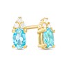 Thumbnail Image 1 of Oval Swiss Blue Topaz and 1/20 CT. T.W. Diamond Stud Earrings in 10K Gold