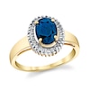Thumbnail Image 0 of Oval Blue Sapphire and 1/6 CT. T.W. Baguette Diamond Frame Ring in 14K Gold