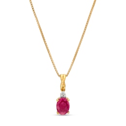 Oval Ruby and Diamond Accent Stacked Twist Bail Pendant in 10K Gold