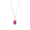 Thumbnail Image 1 of Oval Ruby and White Lab-Created Sapphire Frame Pendant in 10K Gold