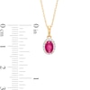 Thumbnail Image 2 of Oval Ruby and White Lab-Created Sapphire Frame Pendant in 10K Gold