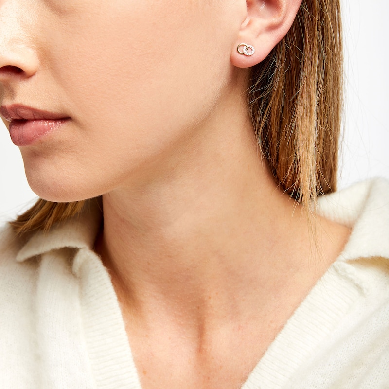 Main Image 2 of 1/10 CT. T.W. Diamond Double Interlocking Circles Stud Earrings in 10K Gold