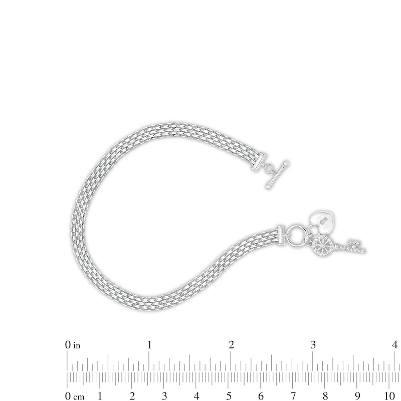 1/10 CT. T.W. Diamond Heart Lock and Key Dangle Charm Bracelet in Sterling Silver - 7.25"