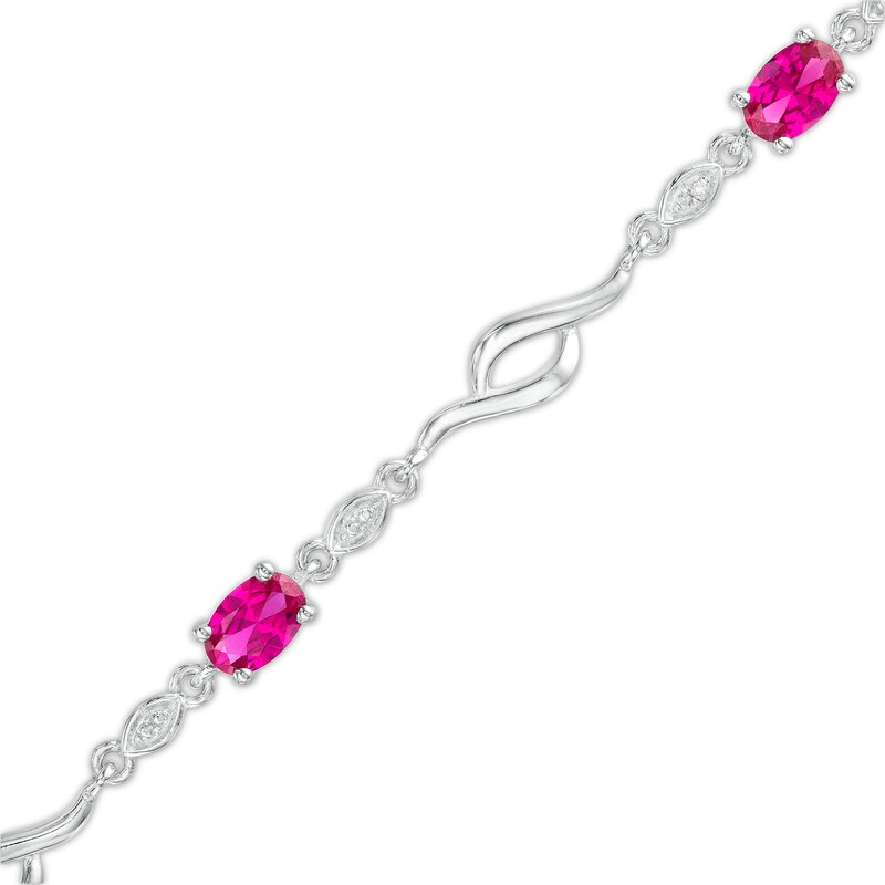 Main Image 1 of Oval Lab-Created Ruby and Diamond Accent Bypass Flame Bracelet in Sterling Silver - 7.25"