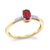 Thumbnail Image 1 of Oval Garnet and 1/20 CT. T.W. Diamond Ring in 14K Gold