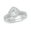 Thumbnail Image 1 of 7.0mm White Lab-Created Sapphire and 1/4 CT. T.W. Diamond Clover Frame Vintage-Style Bridal Set in Sterling Silver