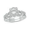 Thumbnail Image 1 of 5.0mm White Lab-Created Sapphire and 1/3 CT. T.W. Diamond Floral Frame Vintage-Style Bridal Set in Sterling Silver