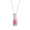 Thumbnail Image 1 of Oval Ruby and 1/5 CT. T.W. Diamond Loop Frame Doorknocker Drop Pendant in 10K Rose Gold