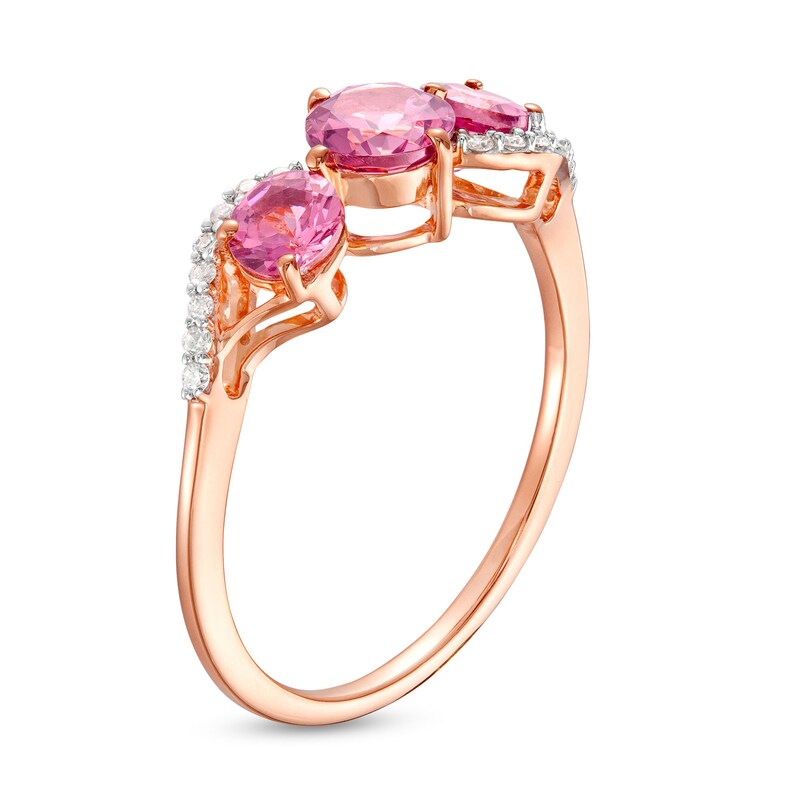 Garnet and 1/15 CT. T.W. Diamond Three Stone Bypass Ring in 10K Rose Gold