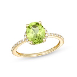 Oval Peridot and 1/10 CT. T.W. Diamond Hidden Frame Ring in 10K Gold