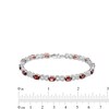Thumbnail Image 4 of Oval Garnet and Diamond Accent Heart-Shaped Infinity Line Bracelet in Sterling Silver - 7.25"