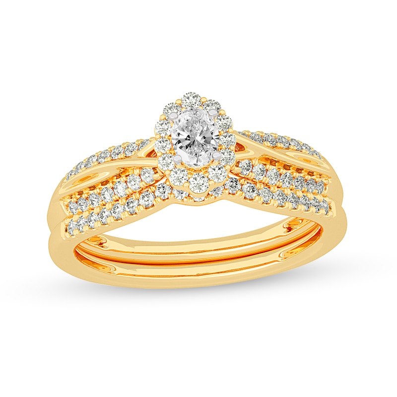 Main Image 1 of 1/2 CT. T.W. Oval Diamond Frame Overlay Bridal Set in 14K Gold