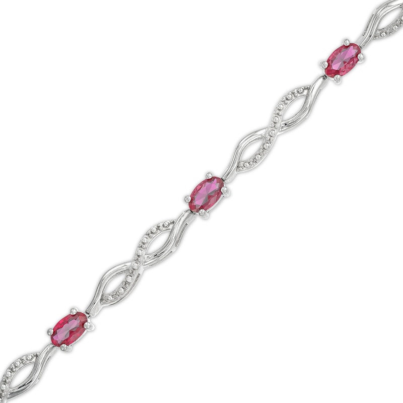 Main Image 1 of Oval Lab-Created Ruby and Diamond Accent Infinity Braid Line Bracelet in Sterling Silver - 7.25"