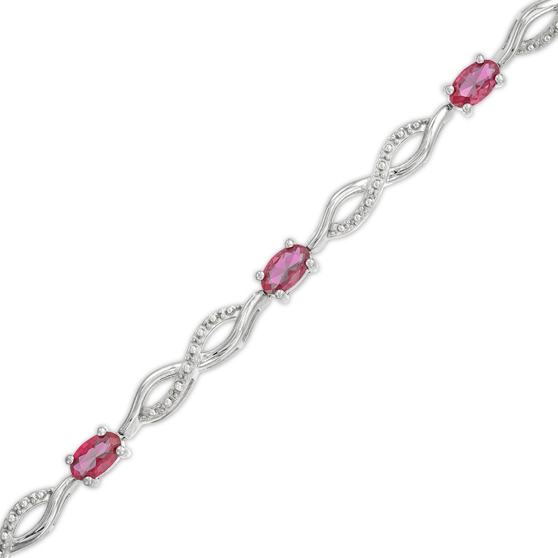 Oval Lab-Created Ruby and Diamond Accent Infinity Braid Line Bracelet in Sterling Silver - 7.25"