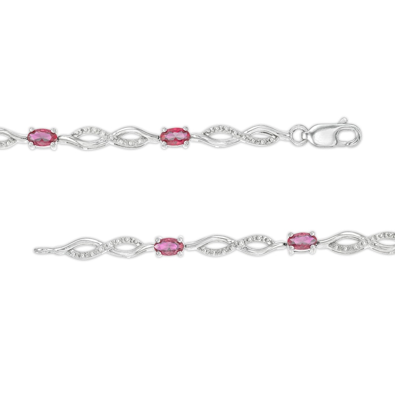 Oval Lab-Created Ruby and Diamond Accent Infinity Braid Line Bracelet in Sterling Silver - 7.25"