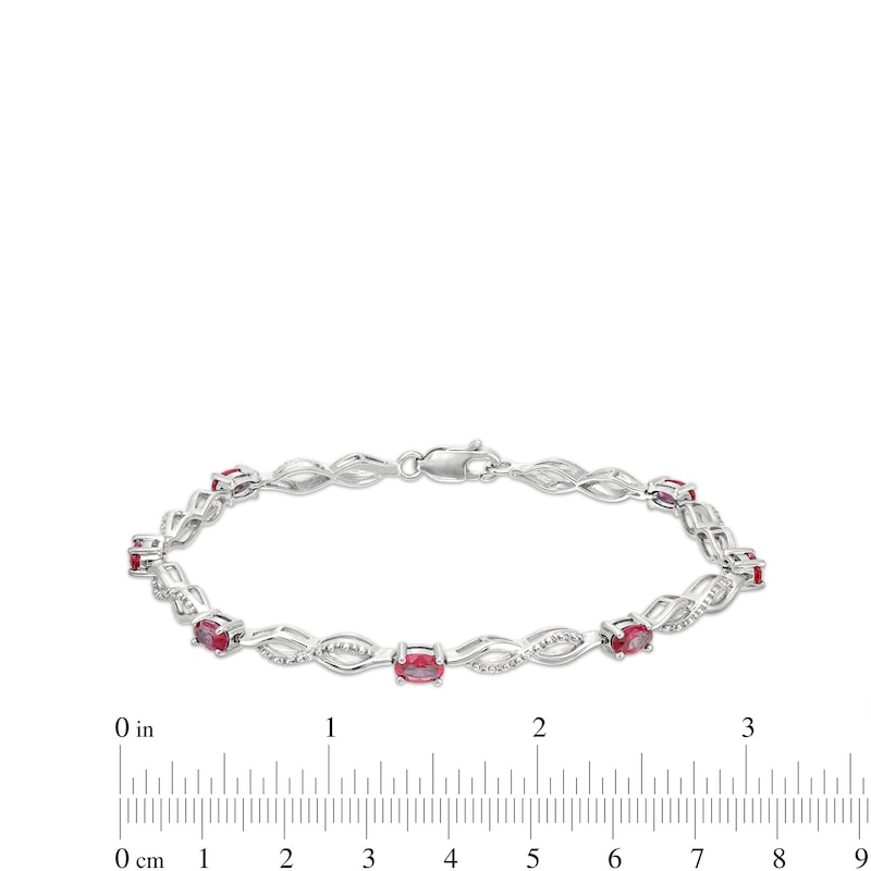 Main Image 4 of Oval Lab-Created Ruby and Diamond Accent Infinity Braid Line Bracelet in Sterling Silver - 7.25"