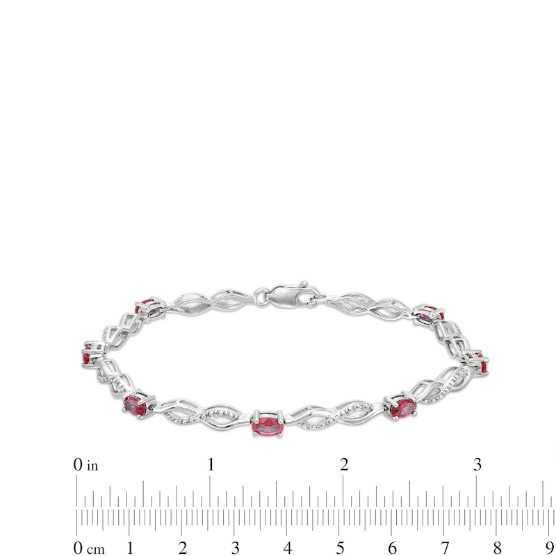 Oval Lab-Created Ruby and Diamond Accent Infinity Braid Line Bracelet in Sterling Silver - 7.25"