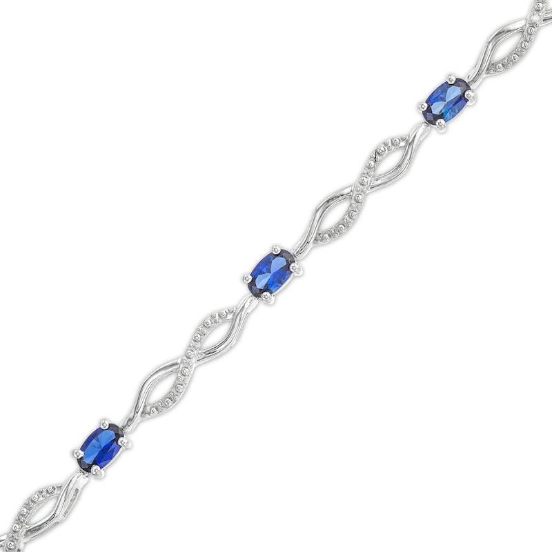 Main Image 1 of Oval Blue Lab-Created Sapphire and Diamond Accent Infinity Braid Line Bracelet in Sterling Silver - 7.25"