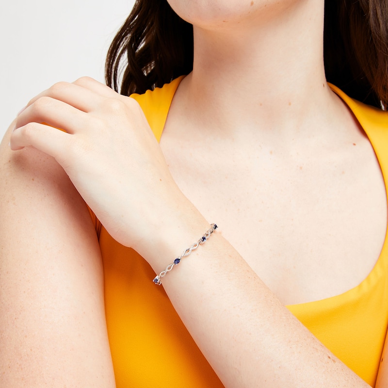 Main Image 2 of Oval Blue Lab-Created Sapphire and Diamond Accent Infinity Braid Line Bracelet in Sterling Silver - 7.25"