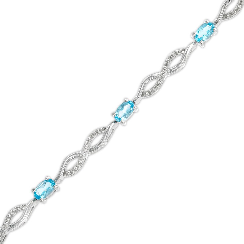 Main Image 1 of Oval Swiss Blue Topaz and Diamond Accent Infinity Braid Line Bracelet in Sterling Silver - 7.25"