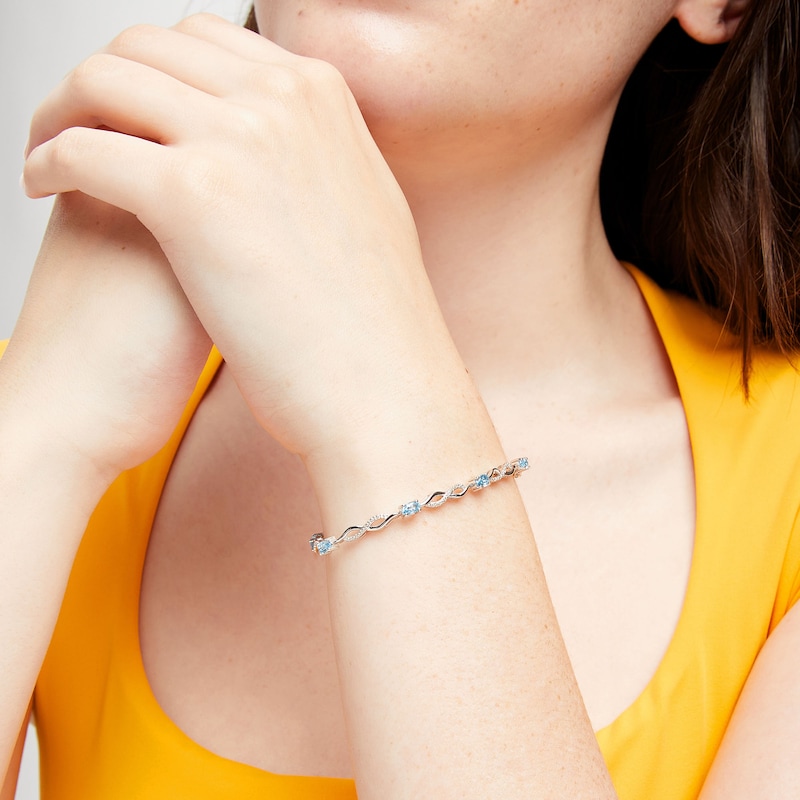 Main Image 2 of Oval Swiss Blue Topaz and Diamond Accent Infinity Braid Line Bracelet in Sterling Silver - 7.25"