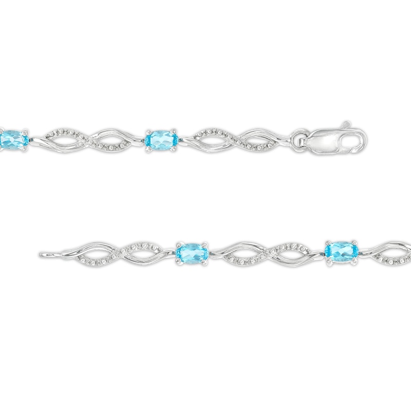 Main Image 3 of Oval Swiss Blue Topaz and Diamond Accent Infinity Braid Line Bracelet in Sterling Silver - 7.25"