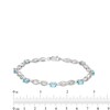 Thumbnail Image 4 of Oval Swiss Blue Topaz and Diamond Accent Infinity Braid Line Bracelet in Sterling Silver - 7.25"