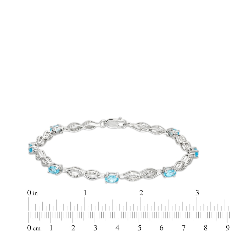 Main Image 4 of Oval Swiss Blue Topaz and Diamond Accent Infinity Braid Line Bracelet in Sterling Silver - 7.25"