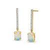 Oval Opal And 1/8 CT. T.W. Diamond Stick Drop Earrings In 10K Gold