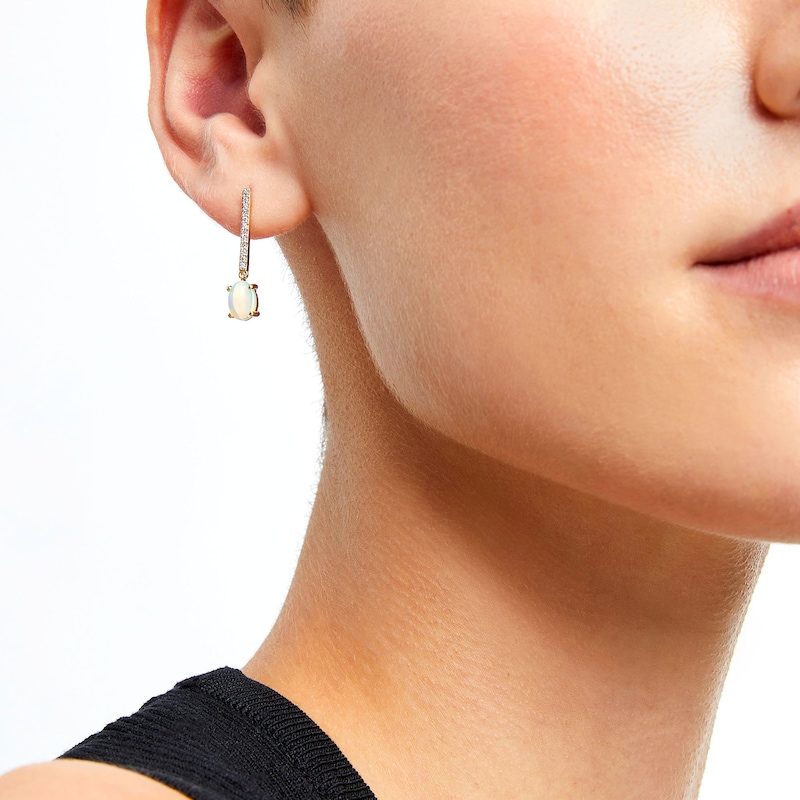 Main Image 2 of Oval Opal and 1/8 CT. T.W. Diamond Stick Drop Earrings in 10K Gold