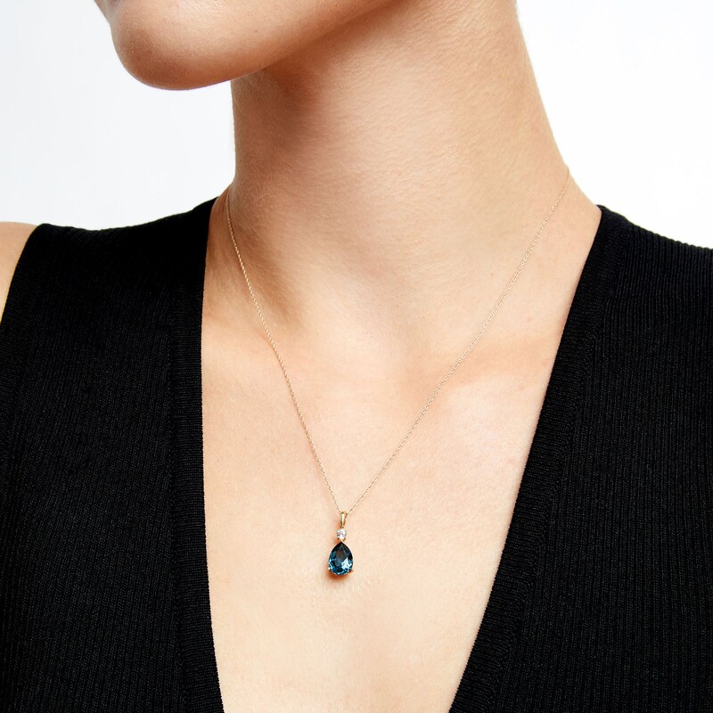 Faceted Pear-Shaped London Blue Topaz and White Lab-Created Sapphire Pendant in 10K Gold