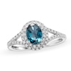 Thumbnail Image 0 of Oval London Blue Topaz and 1/6 CT. T.W. Diamond Framed Ring in 10K White Gold