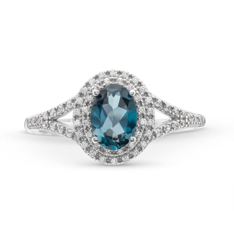 Oval London Blue Topaz and 1/6 CT. T.W. Diamond Framed Ring in 10K White Gold