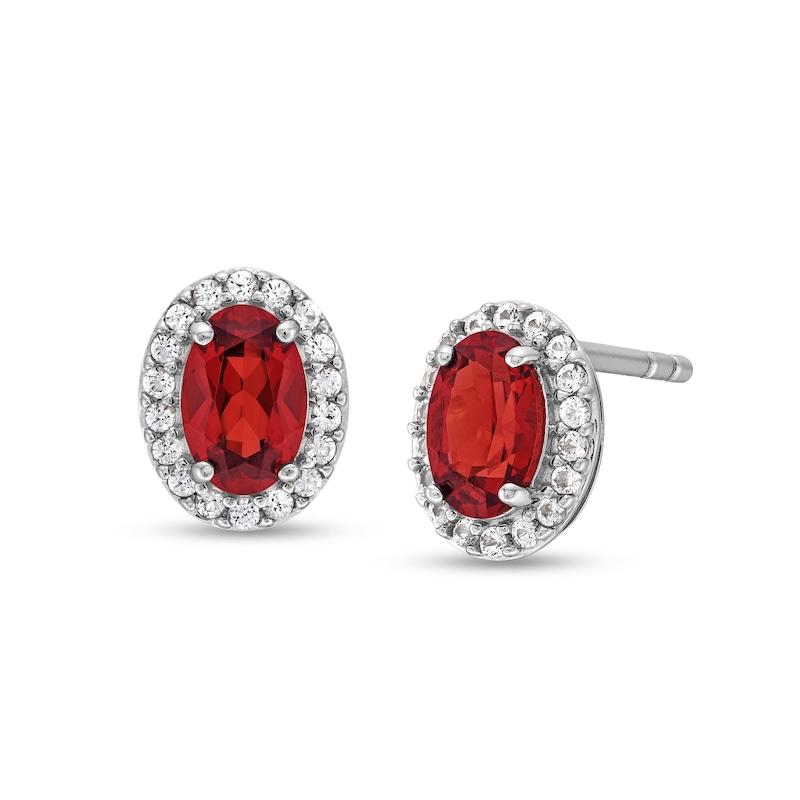 Main Image 1 of Oval Garnet and White Lab-Created Sapphire Frame Stud Earrings in Sterling Silver