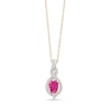 Thumbnail Image 1 of Oval-Shaped Ruby and 1/10 CT. T.W. Diamond Swirl Frame Pendant in 10K Gold